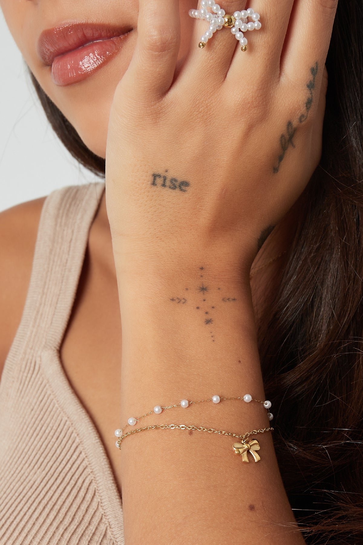 Dubbele armband met strik en parels